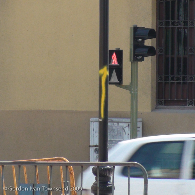View SW along Calle Mayor (El Camino) towards hand-painted yellow-arrow way-marker (on pole) - Villava - Day 3