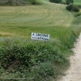 View SE from path (El Camino) towards handmade sign: "A Santiago 747 km" ~210 m past city limit of Uterga - Day 4